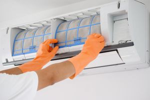 HVAC pro contractor fixing an AC unit